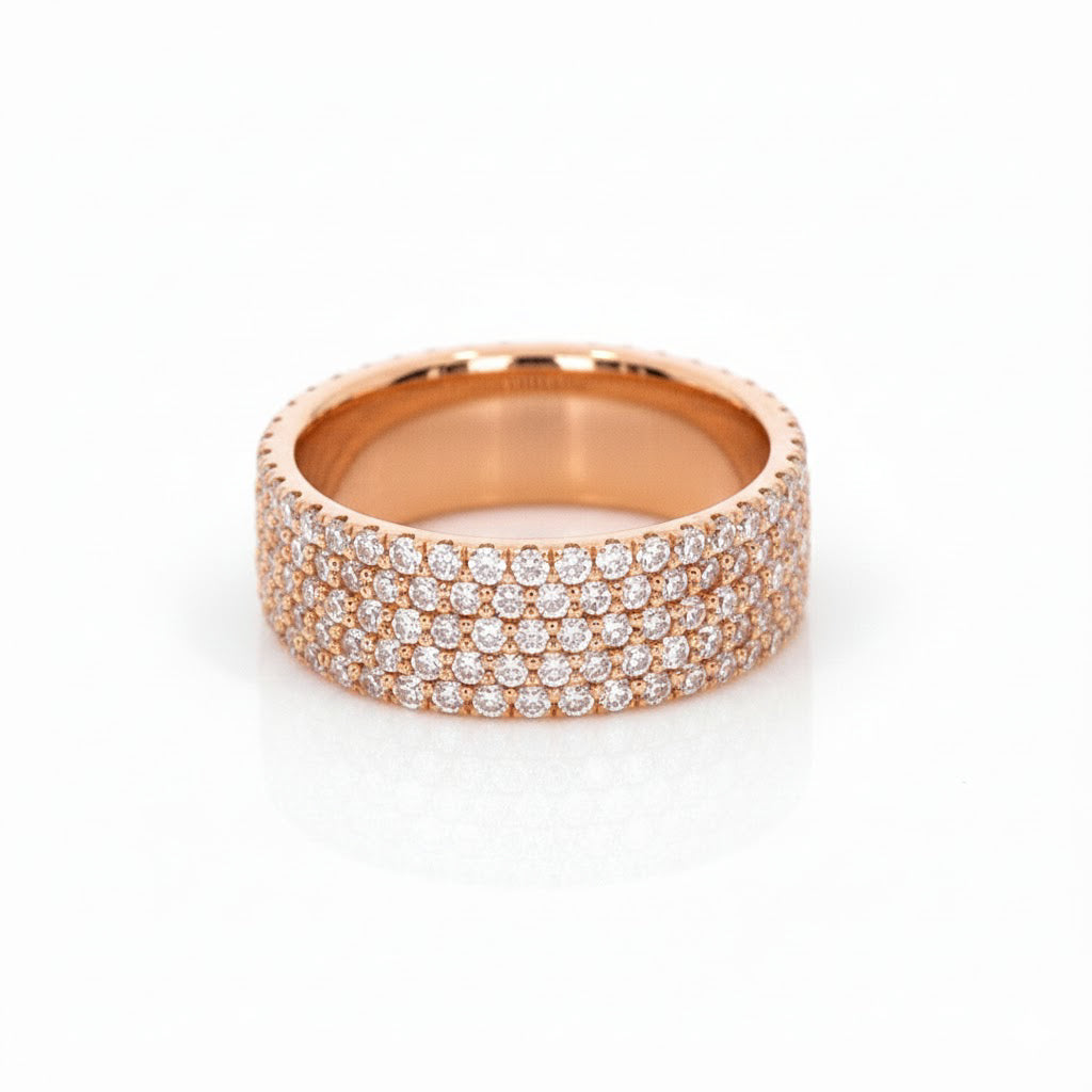 Rose gold ring with multiple rows of diamonds on a white background