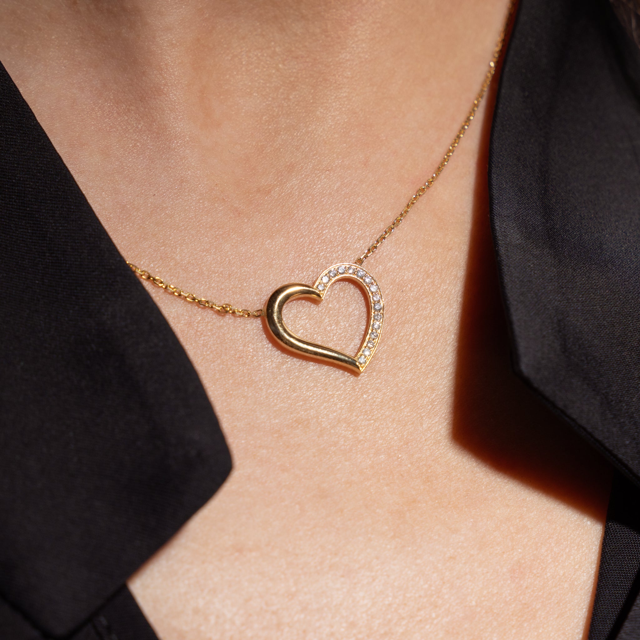Heart shaped diamond necklace in a delicate gold chain