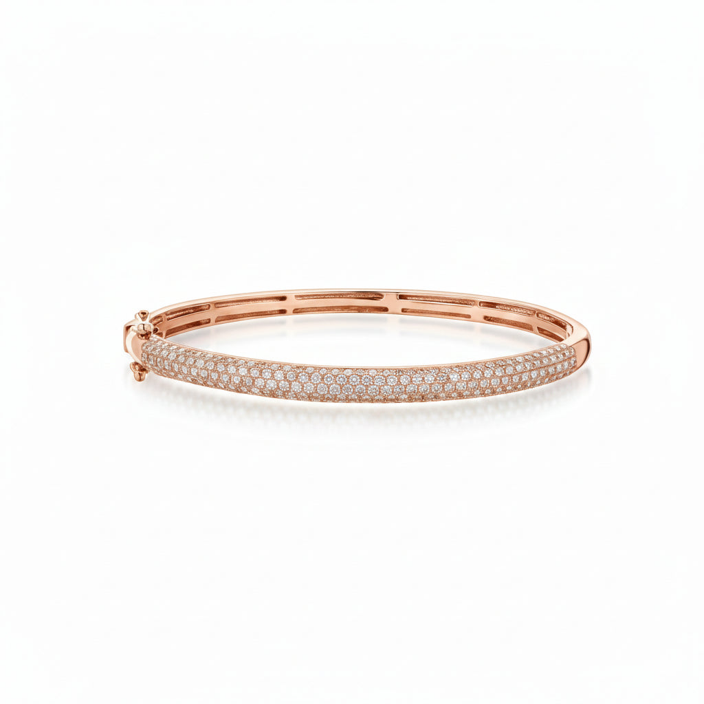 Rose gold bracelet with small diamonds on a white background