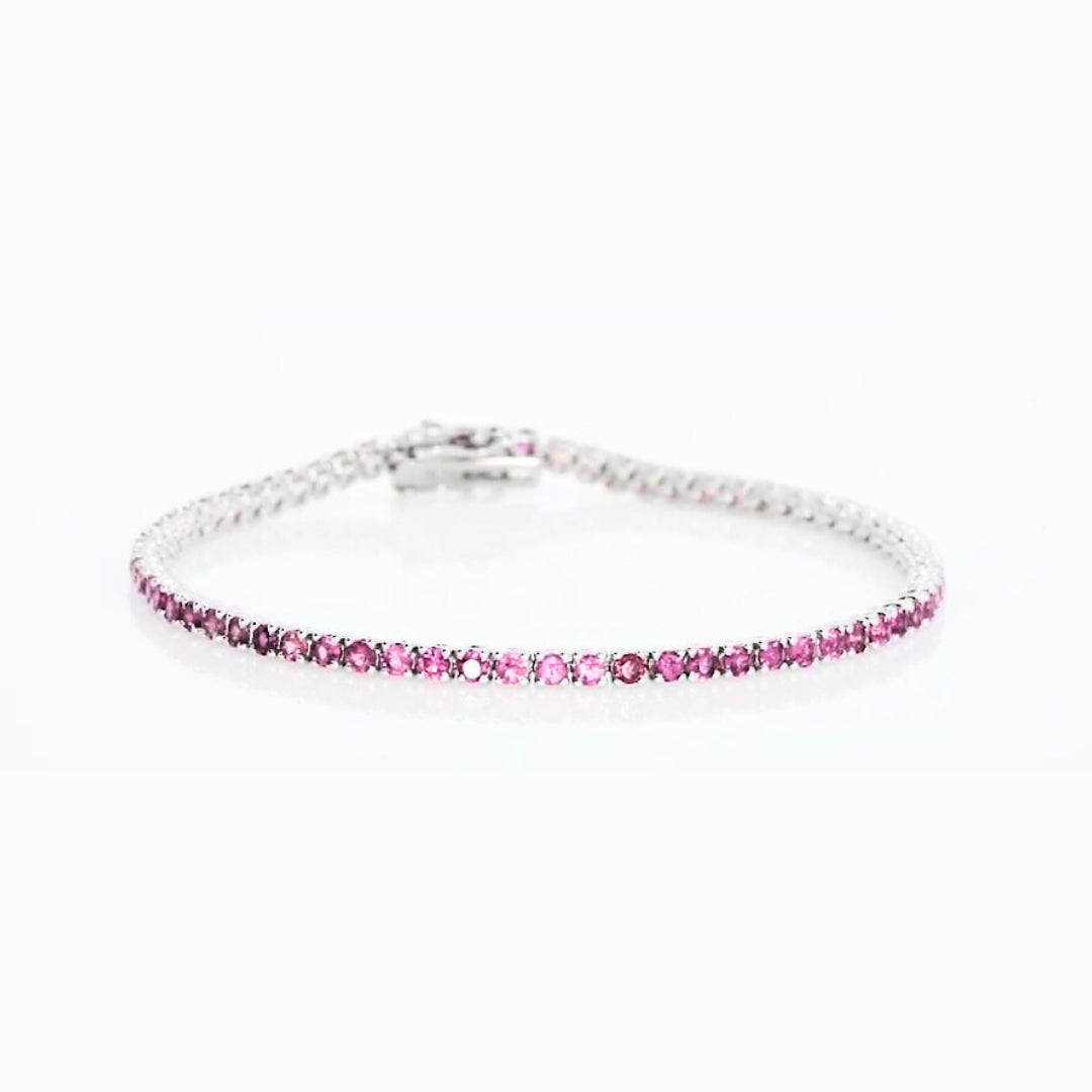 Elegant pink tourmaline tennis bracelet set in 18ct white gold showcasing a feminine glow of 2.50cts of gemstones.