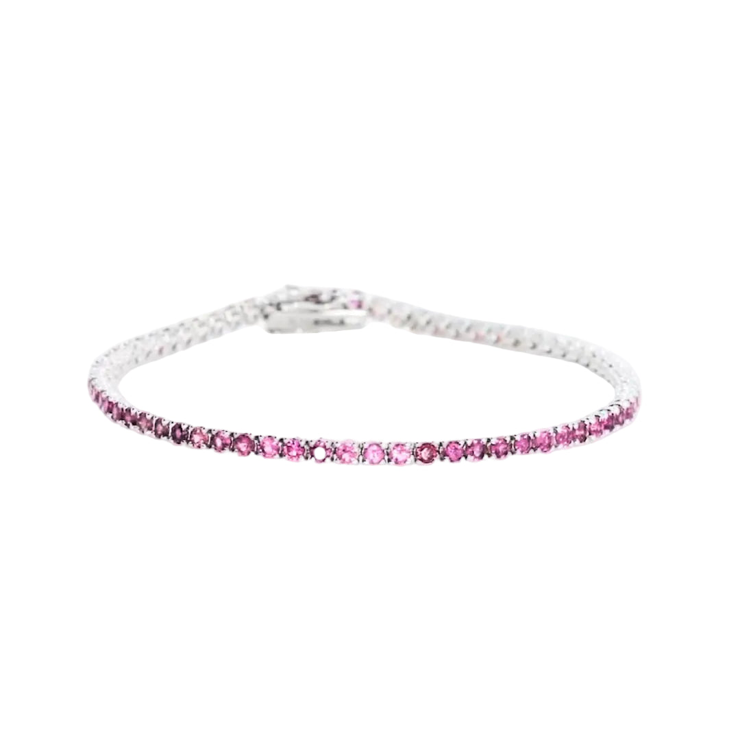 Elegant pink tourmaline tennis bracelet set in 18ct white gold showcasing a feminine glow of 2.50cts of gemstones.