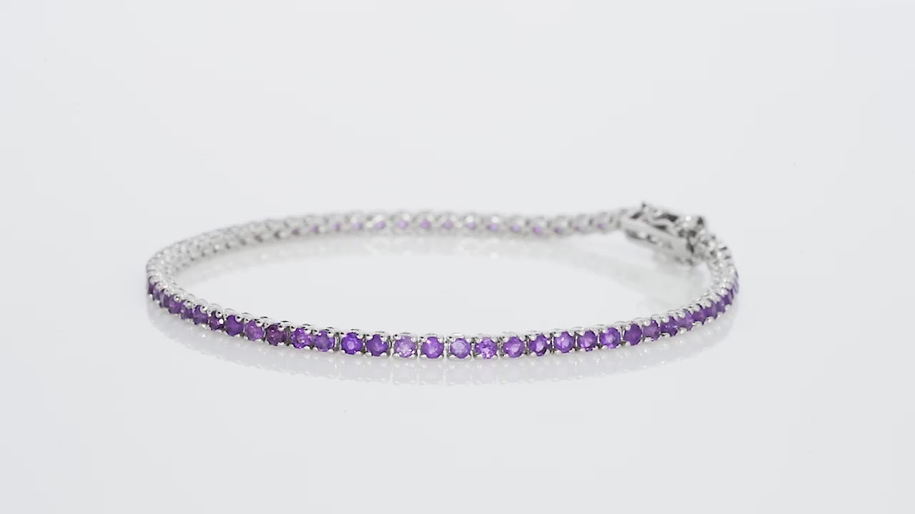 Amethyst tennis bracelet featuring rich purple gemstones set in 18ct white gold, perfect for any occasion.