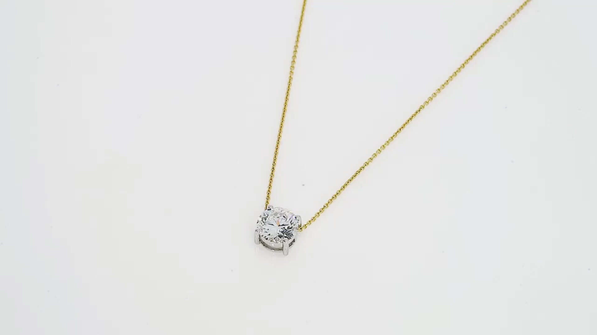 Elegant Floating Diamond Necklace on 18ct gold chain, showcasing brilliant cut diamond in classic four claw setting.
