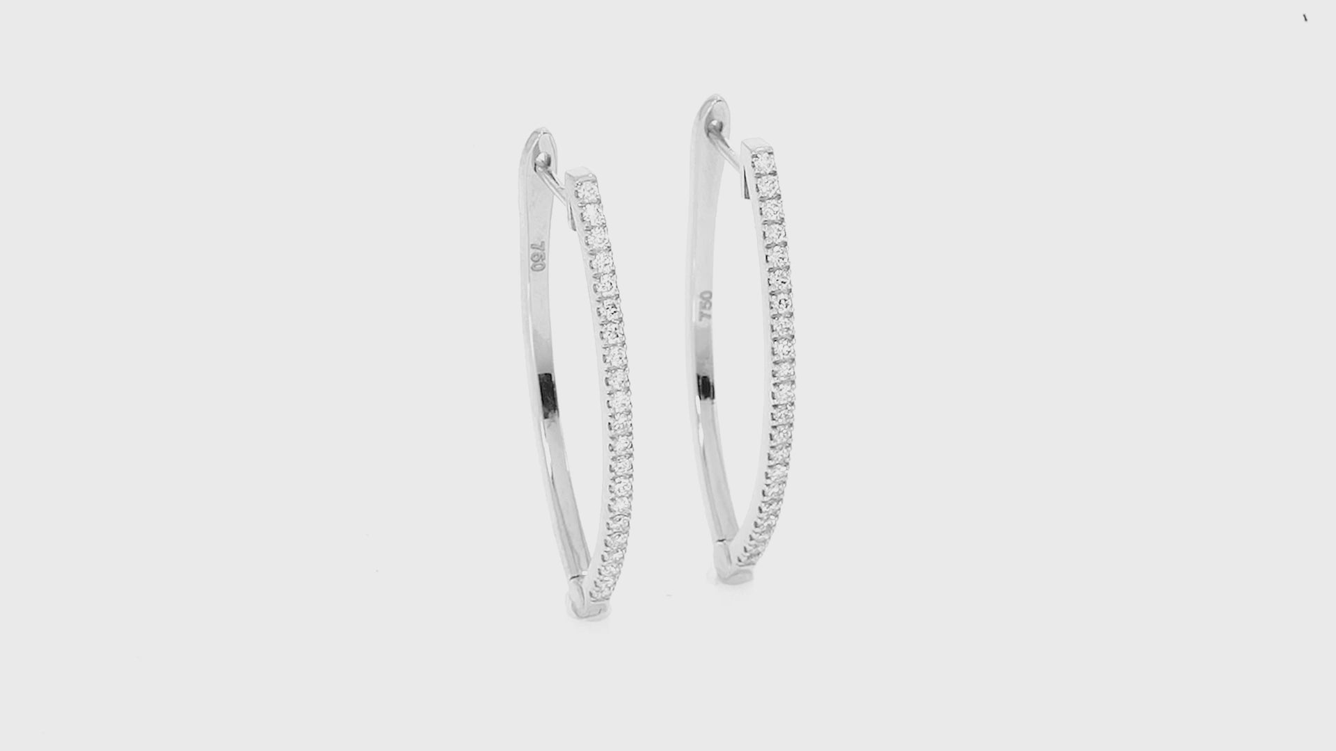 Modern V-shaped certified diamond earrings in solid gold with brilliant cut diamonds accenting the elegant design.
