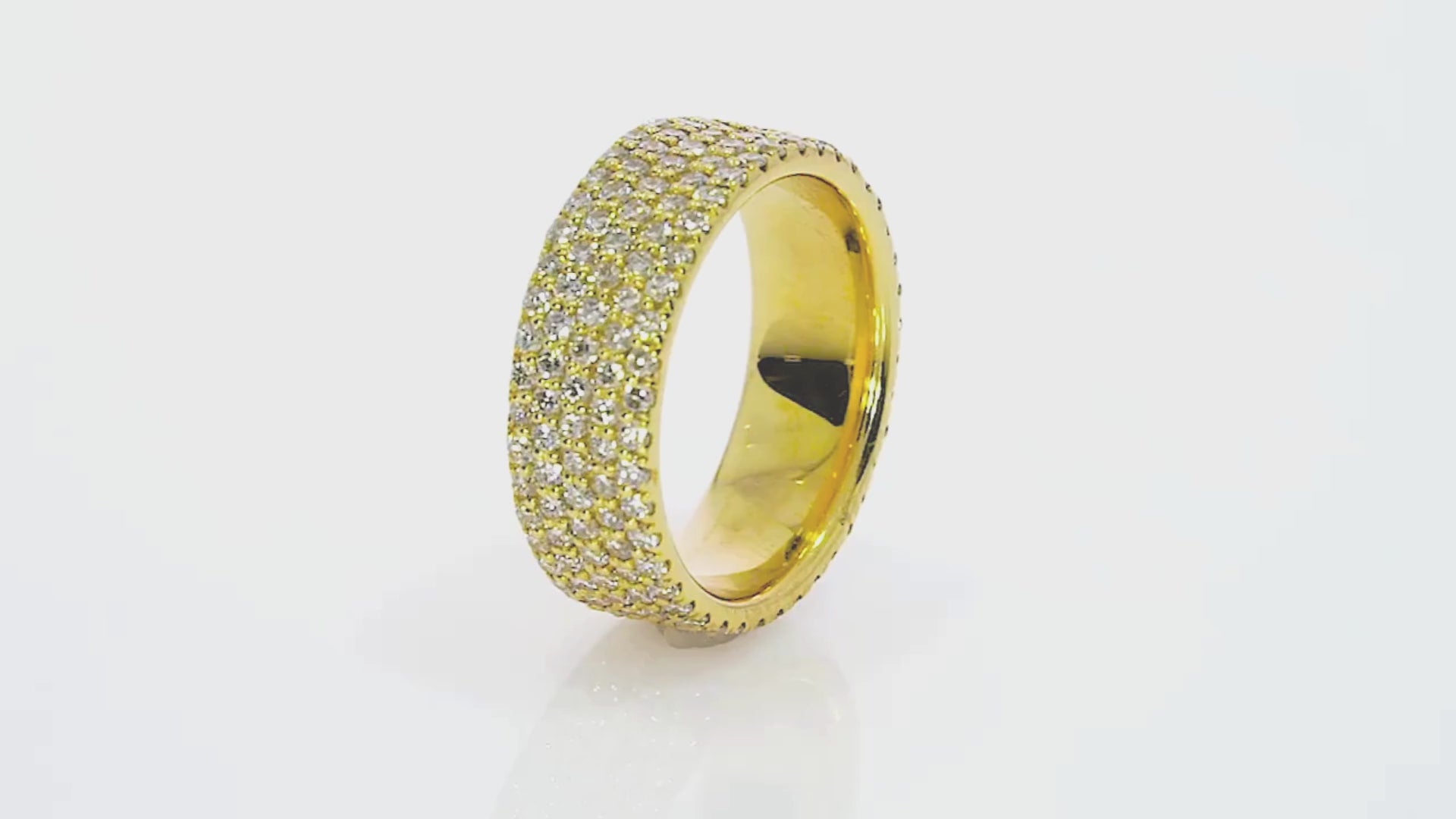 Four row pavé diamond ring in yellow gold showcasing round brilliant cut diamonds with stunning brilliance.