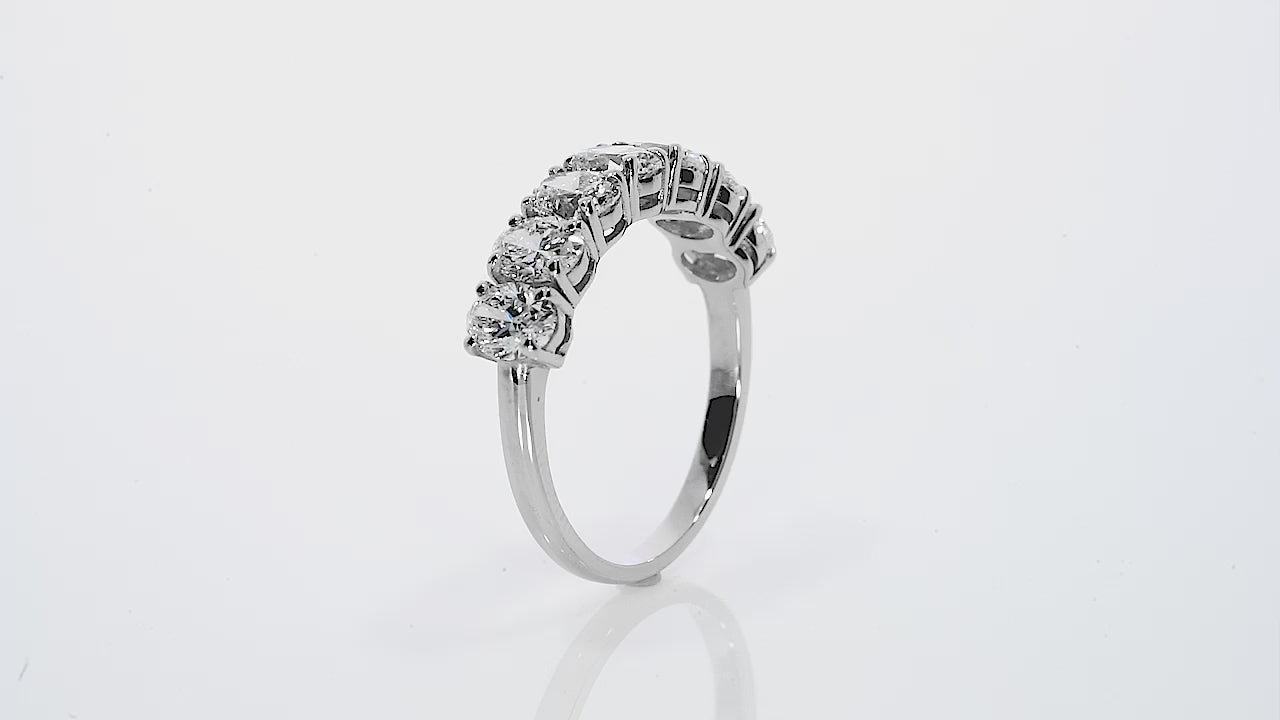 Seven stone oval certified diamond ring with exceptional craftsmanship and sparkling brilliance.