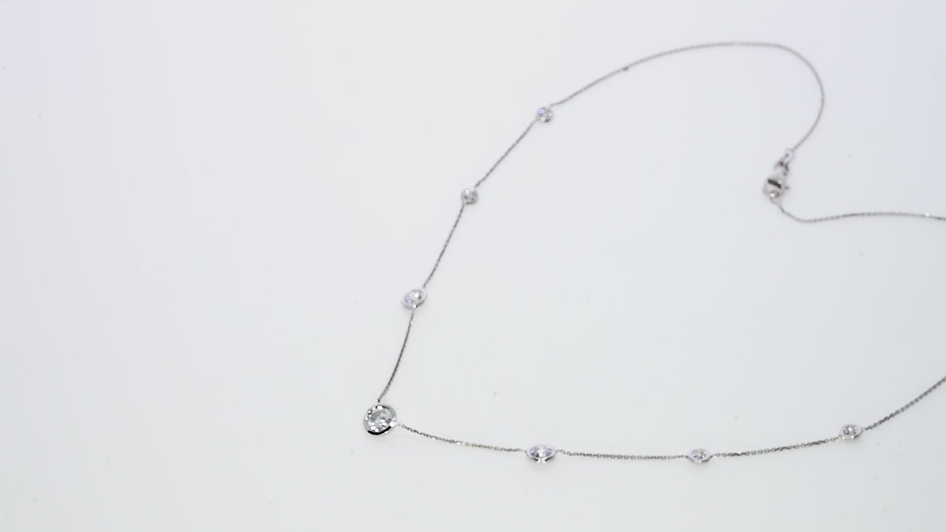 Constellation Necklace - Graduating featuring seven diamonds in 18ct gold, perfect for elegant occasions and luxury looks.