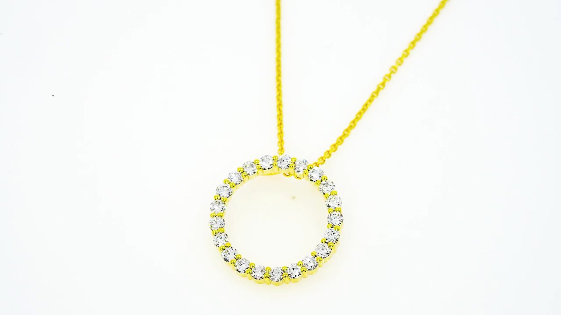 Circle Of Life Necklace - Small with white diamonds in a yellow gold setting on a delicate chain.