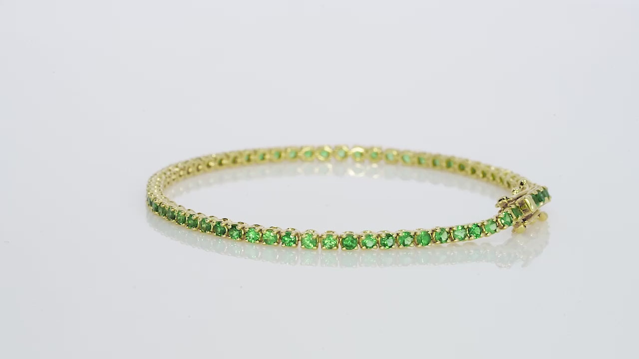 Elegant green tsavorite tennis bracelet in 18ct yellow gold from the gemstone collection, showcasing 2.50cts of vibrant gem quality.