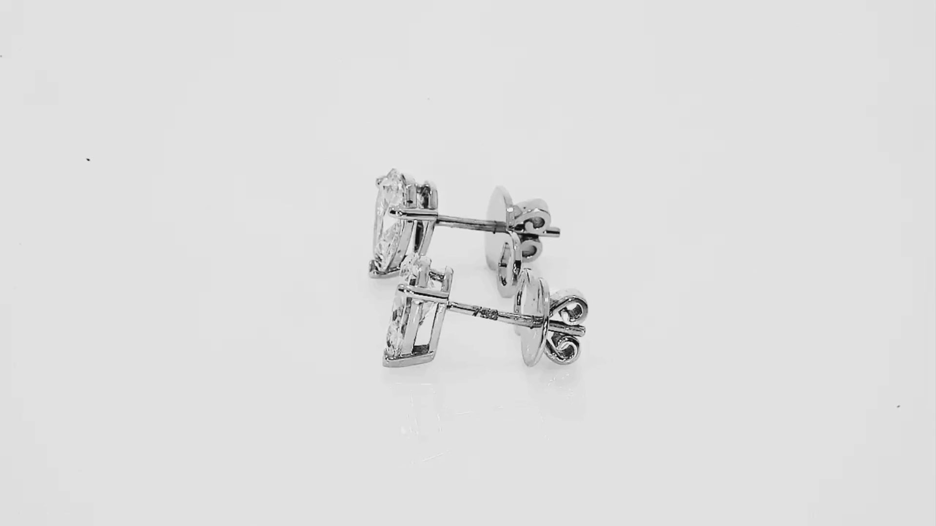 Pear Diamond Stud Earrings showcasing elegant pear shape diamonds set in white gold.