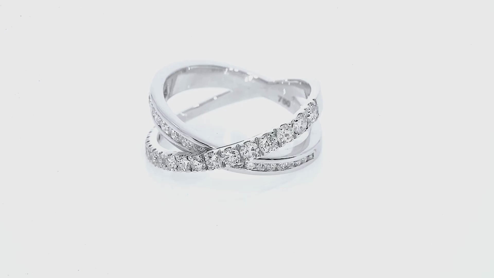 Video Criss-cross ring large with 0.84cts of claw-set luxury fine diamonds, intersecting bands for a sparkling look set in 18ct gold.