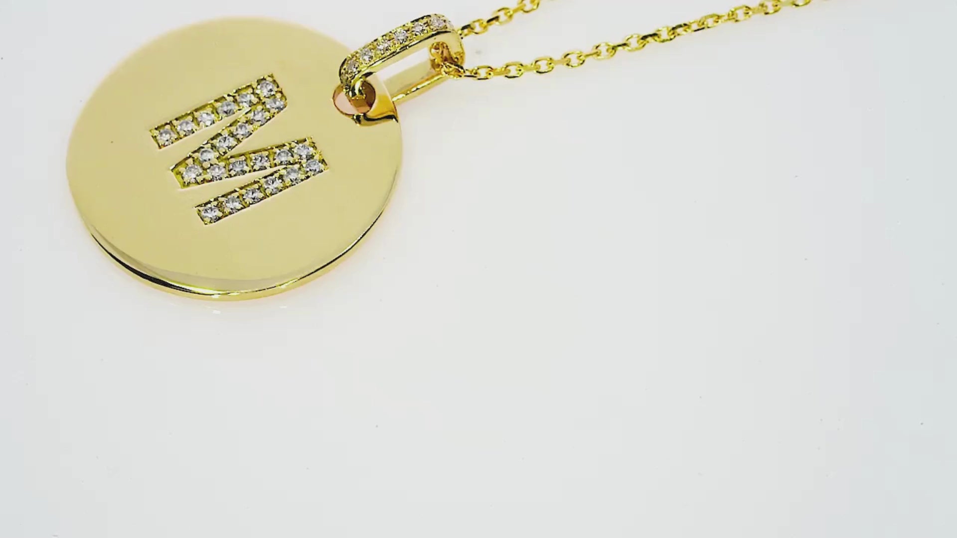 Love Letter Disk necklace featuring certified diamonds in gold, customisable with your initials.