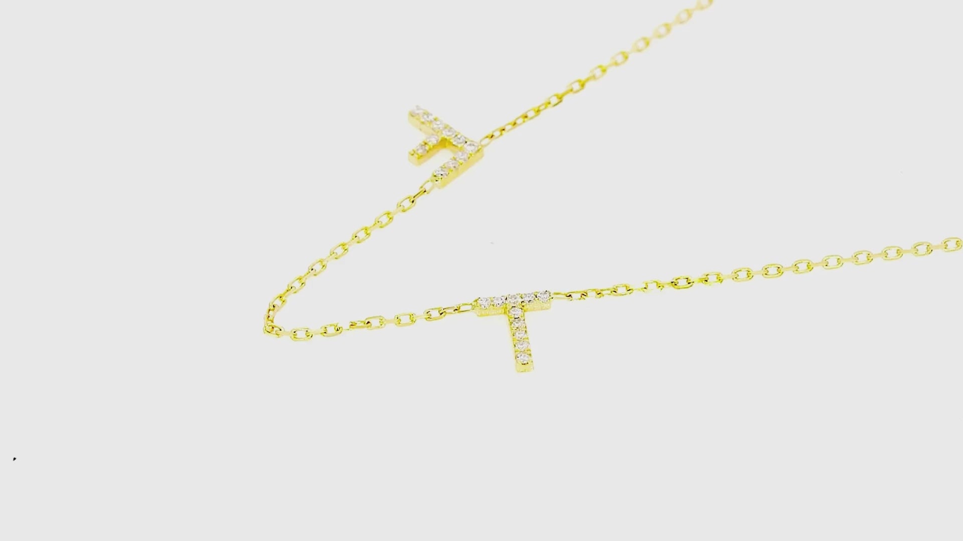 Love Letter necklace featuring natural diamond initials on a fine gold chain, perfect for a sentimental gift.
