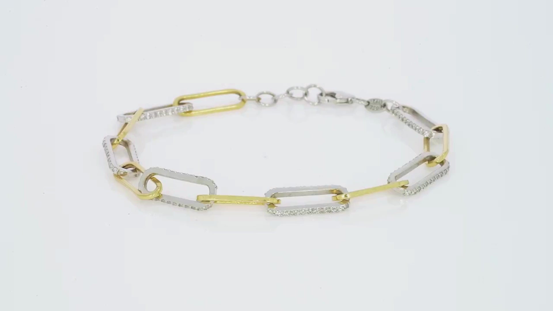 Modern chain link bracelet in 18ct white and yellow gold with diamonds sparkling at every turn.