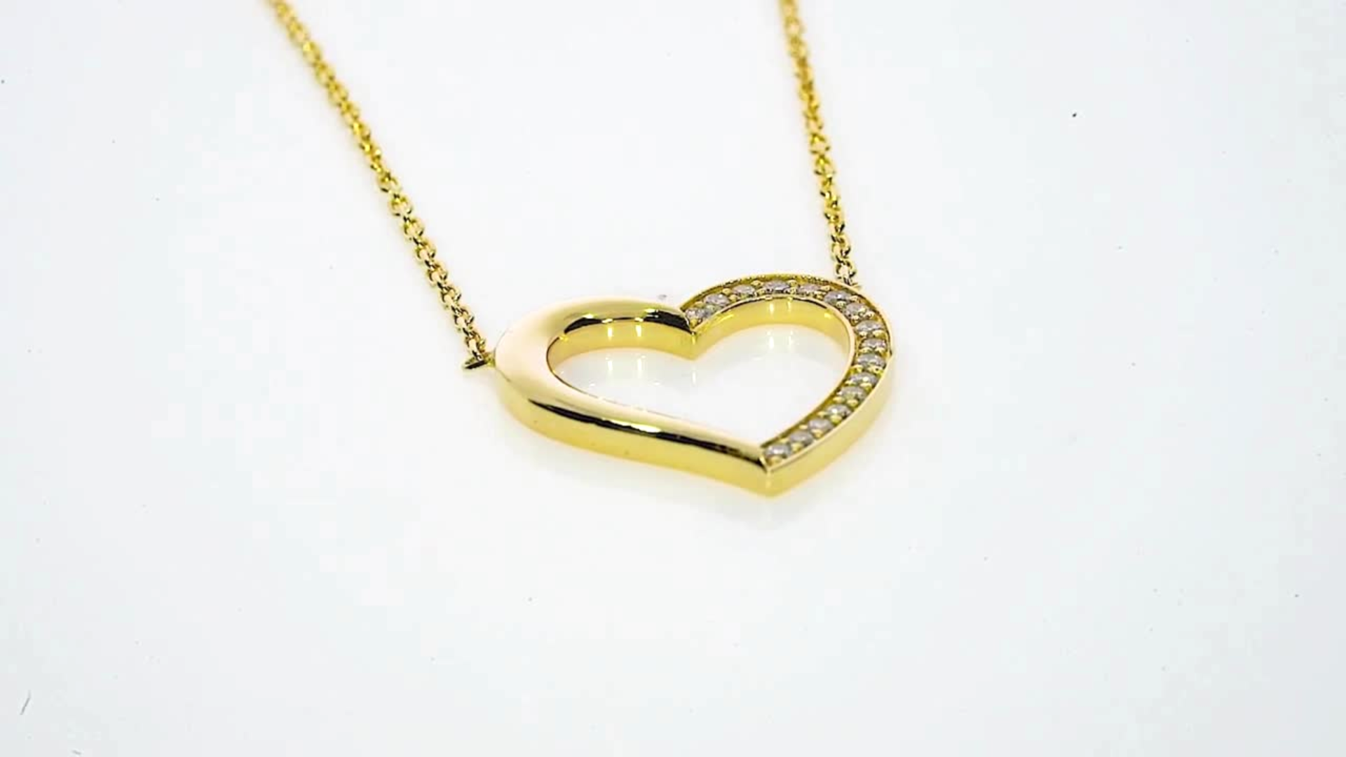 18ct gold heart necklace with diamond accents, perfect for adding elegance and charm to any outfit.
