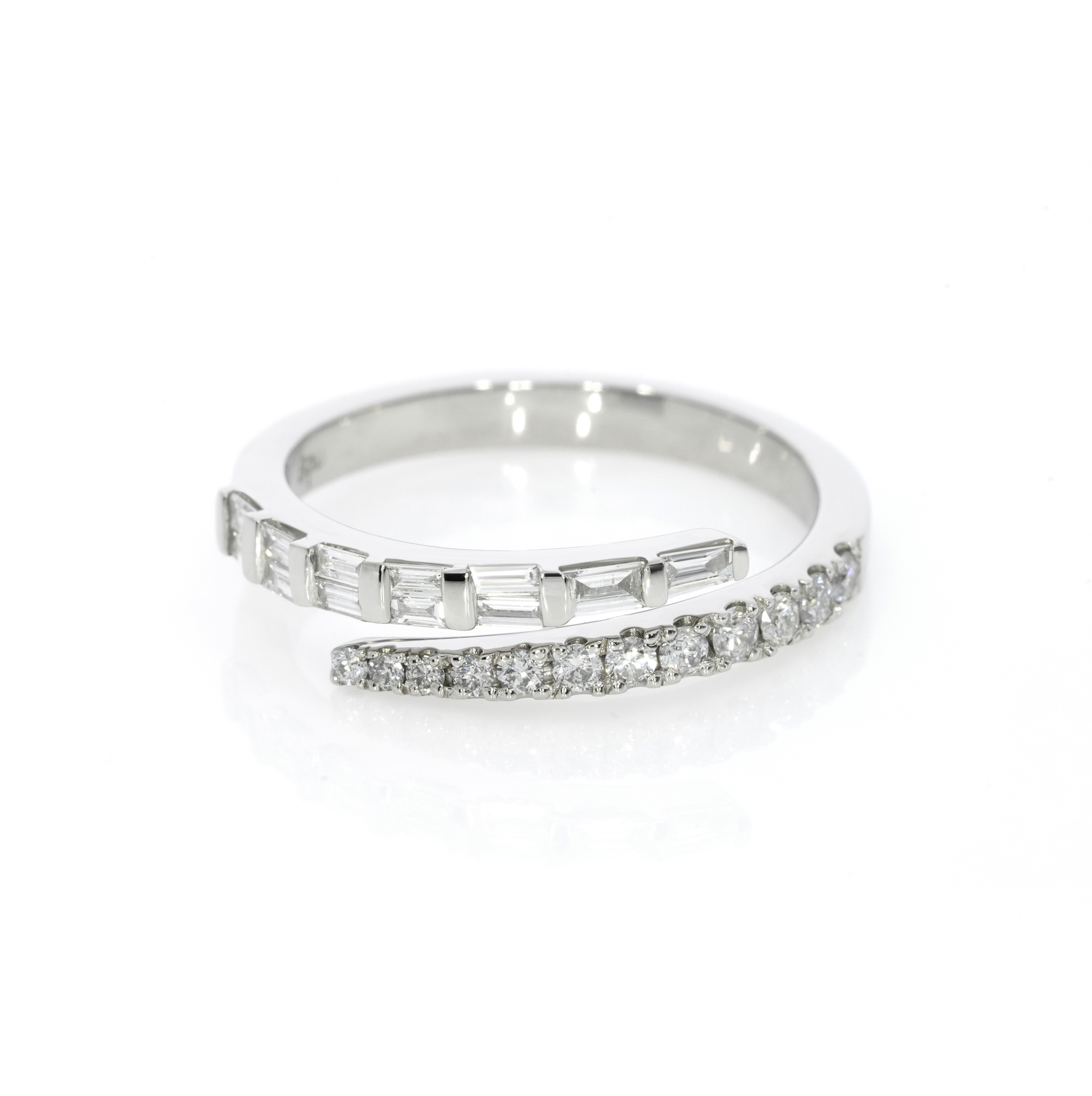 Luxury fine wrap ring with sparkly round brilliant and baguette cut diamonds, white gold colour, set in 18ct gold.
