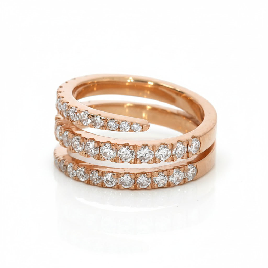 Rose gold ring with diamonds on a white background
