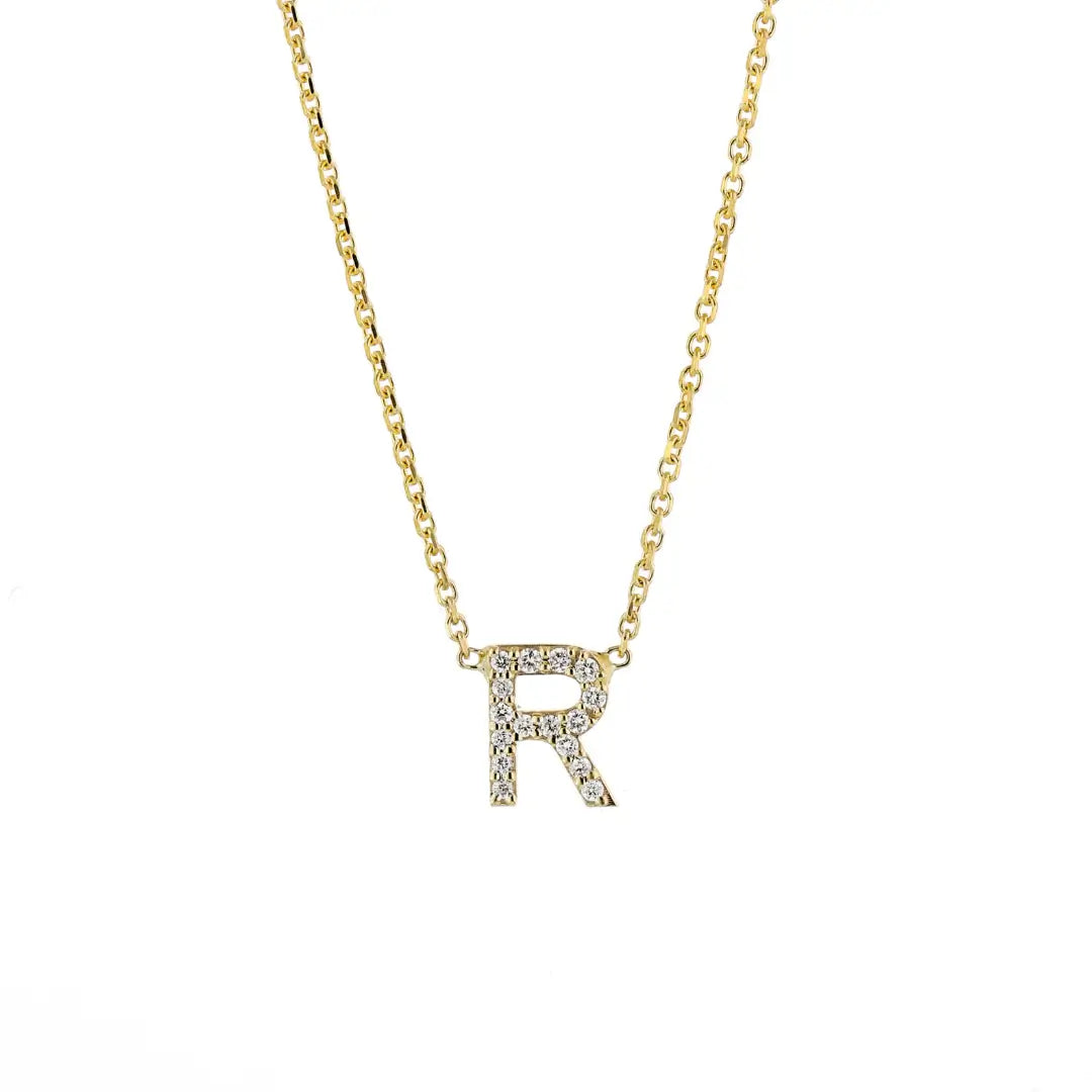 Single Love Letter Necklace in yellow gold featuring a diamond-encrusted letter R pendant on a fine chain.