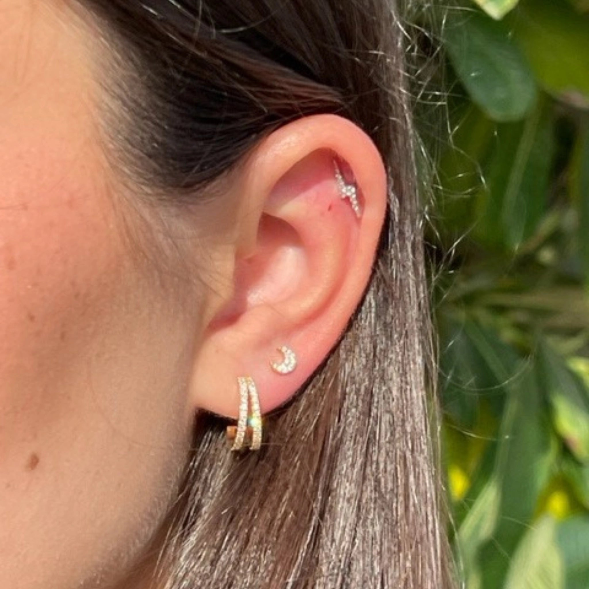 Small moon earring in 18ct gold showcasing certified diamond earrings, elegant and suitable for everyday wear.