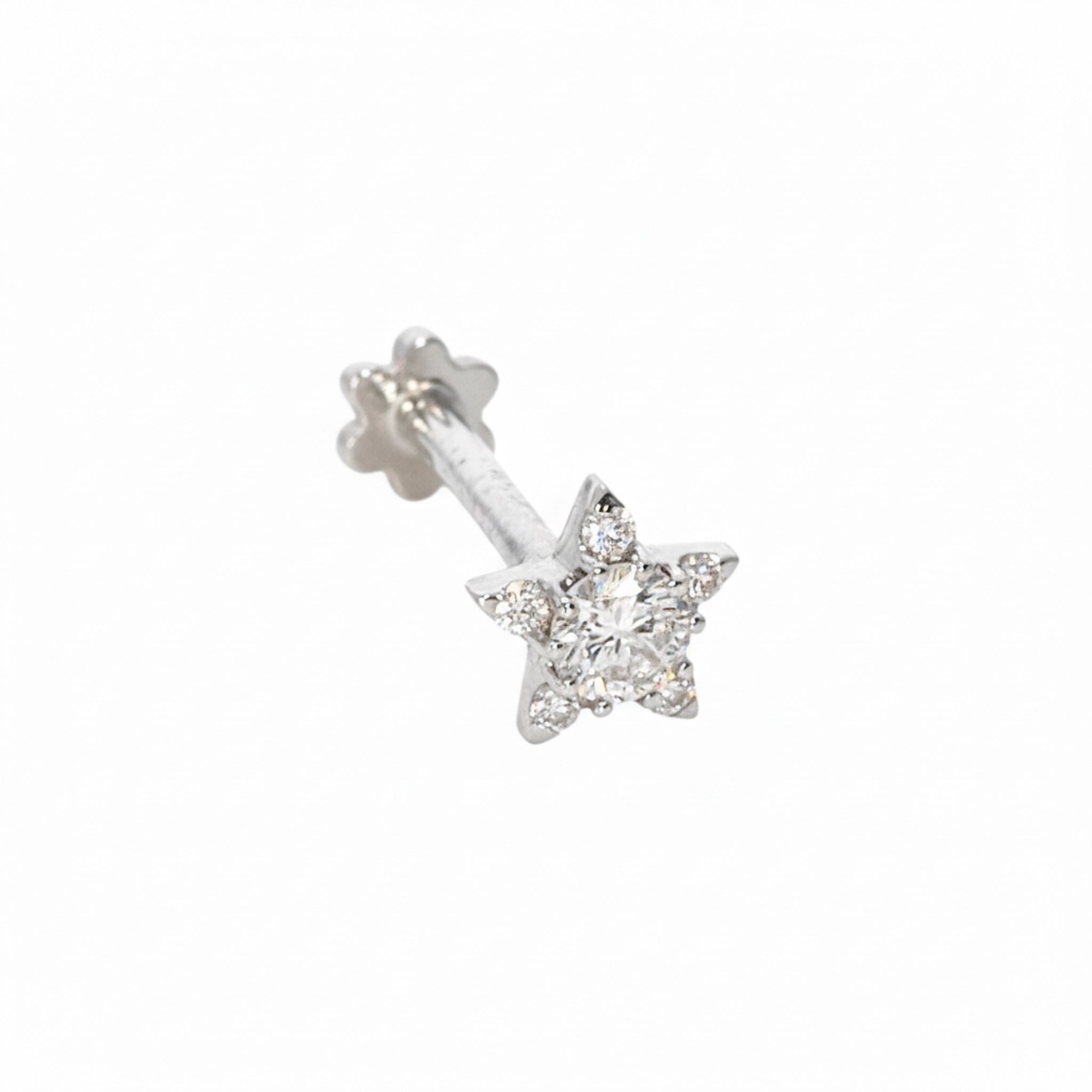 Star-shaped earring with diamonds on a white background