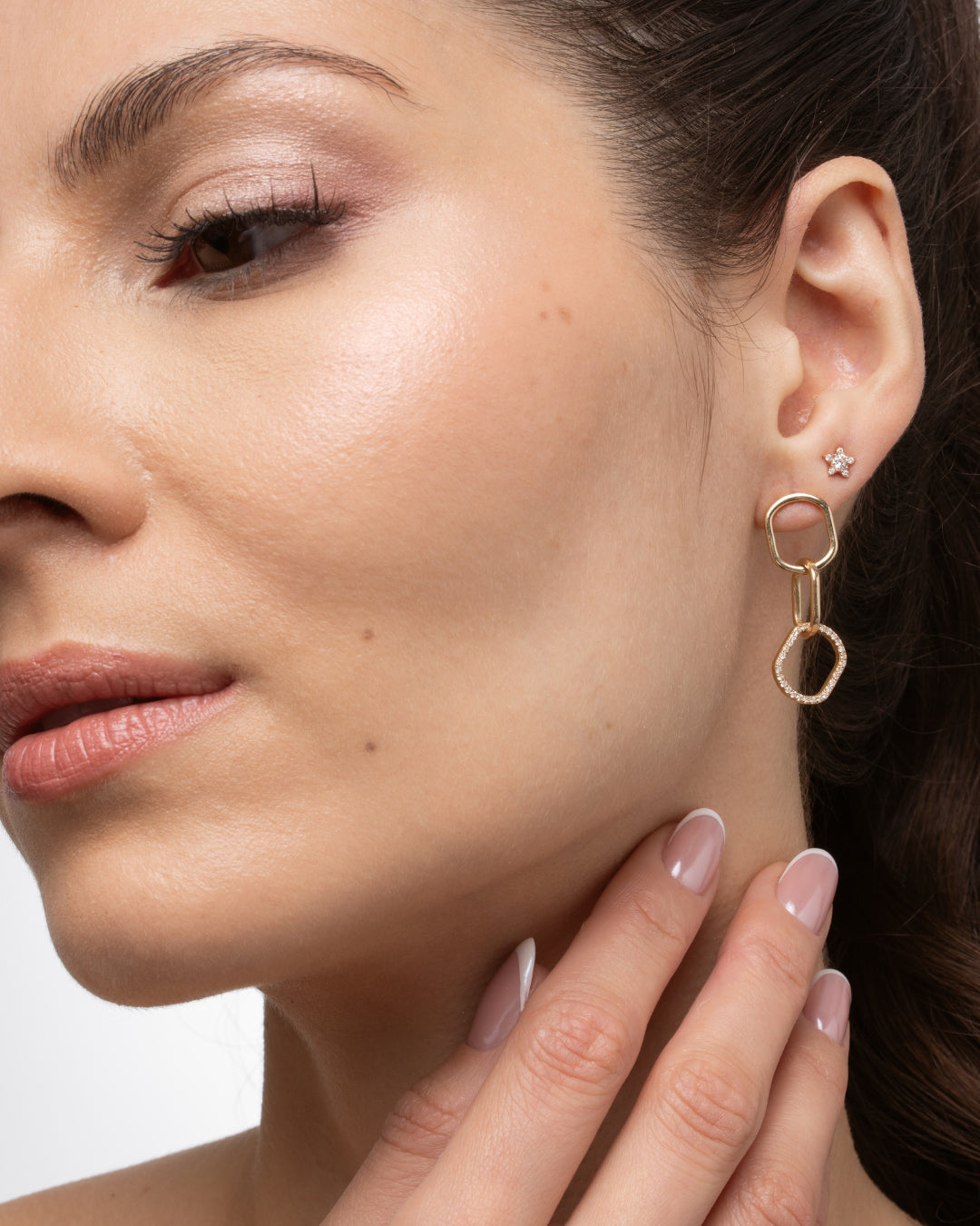 Model showcasing chain link diamond earrings with interlocking links in solid 18ct gold and sparkling certified diamond accents.