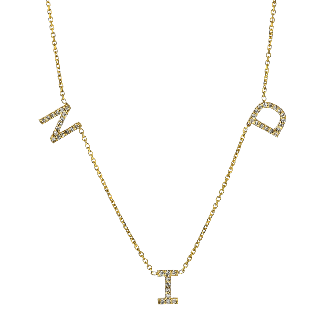 Love letter gold necklace with diamond initials on a sleek chain, offering timeless elegance and personalized sophistication.