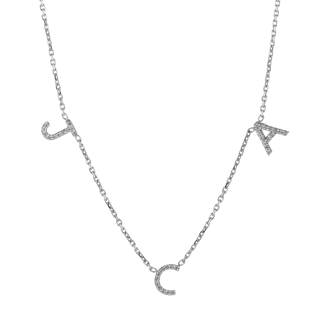 Love Letter necklace with natural diamond initials on a fine link chain featuring sparkling details.