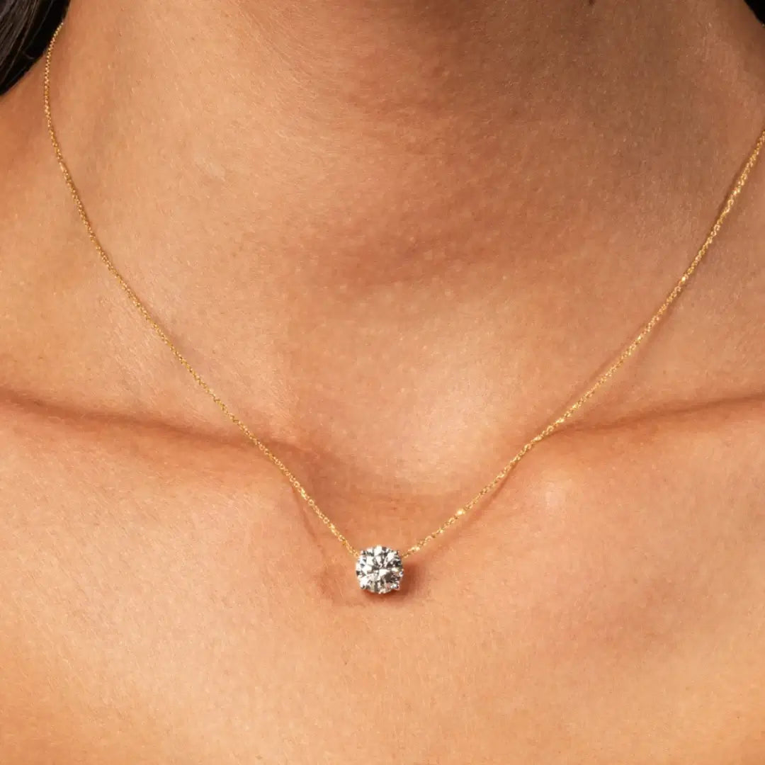 Elegant 18ct gold chain with a floating round diamond necklace worn elegantly against the skin.