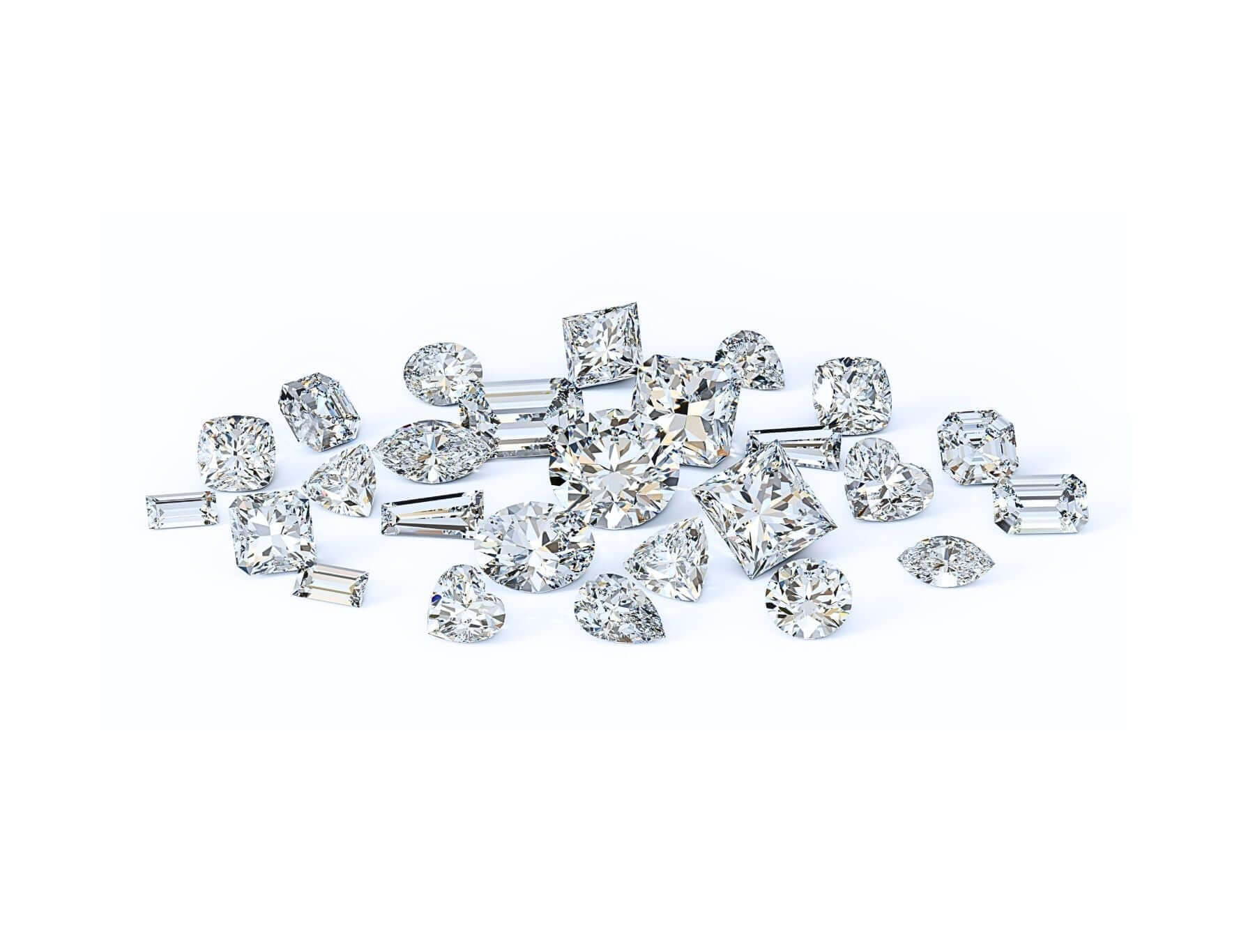 Various cut diamonds scattered, showcasing exquisite diamond jewellery and its stunning designs.