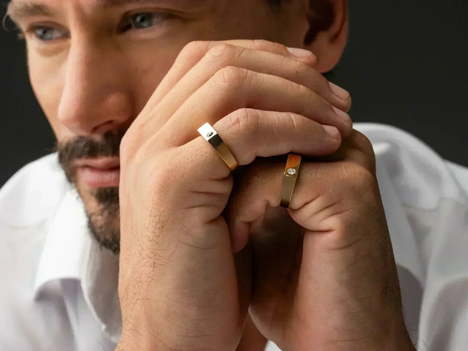 Man showcasing signet rings, representing perfect Father's Day jewellery gifts he'll actually wear.