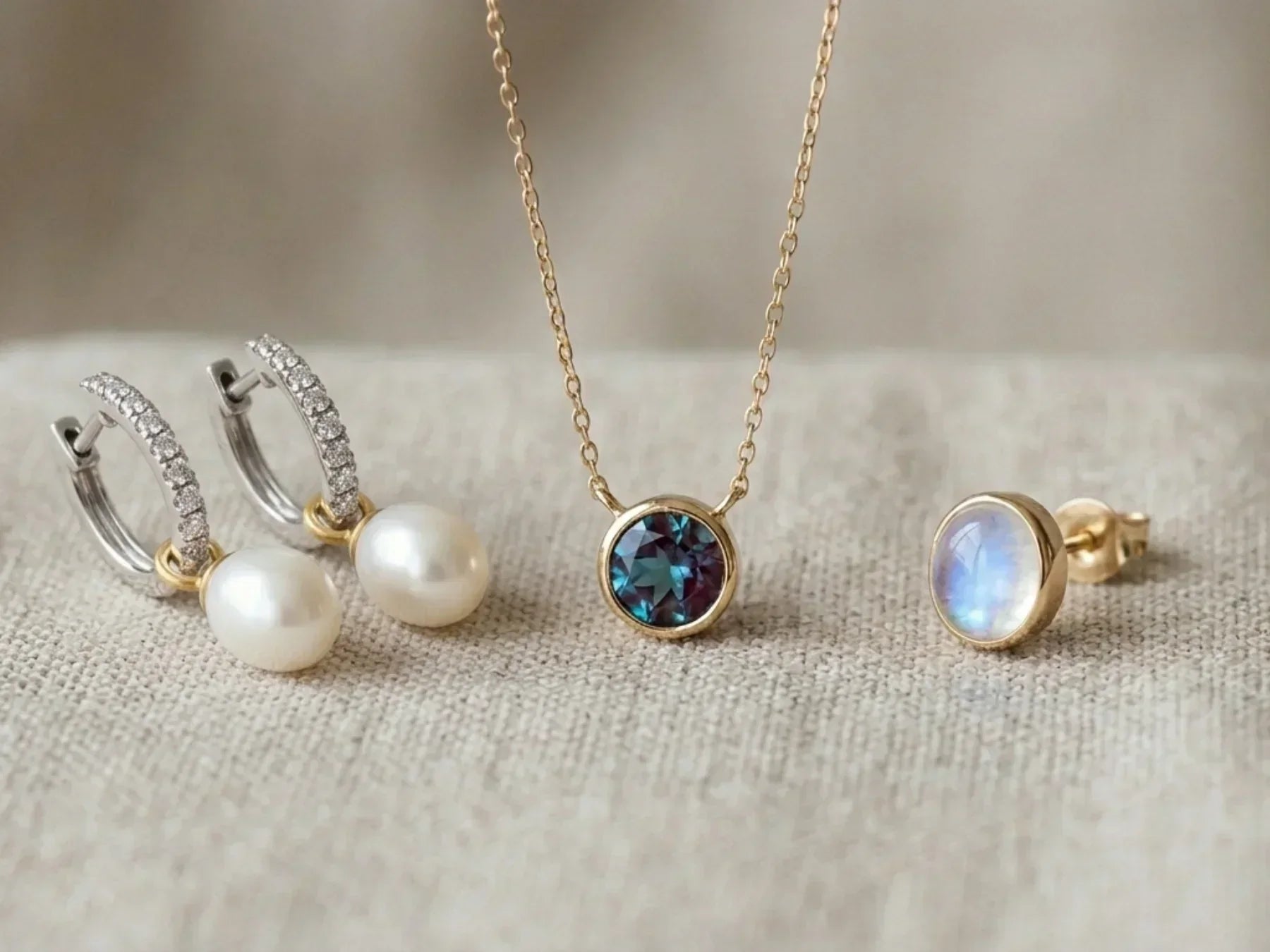 Jewelry featuring June's birthstone earrings and necklace with pearl, alexandrite, and moonstone.