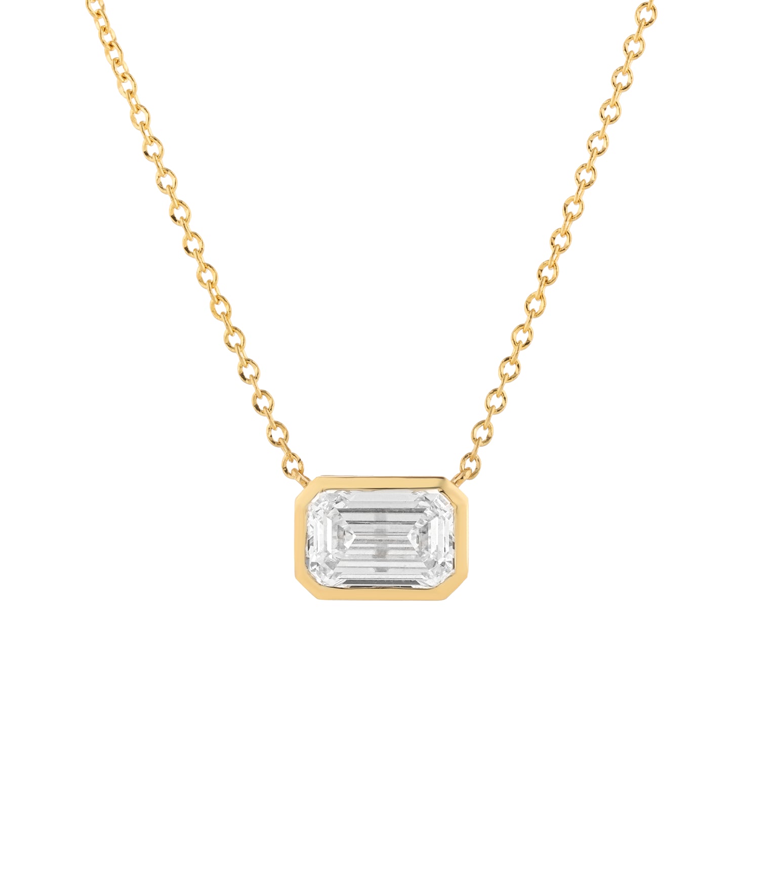 A gold necklace with a emerald cut diamond pendant, shown against a plain white background.