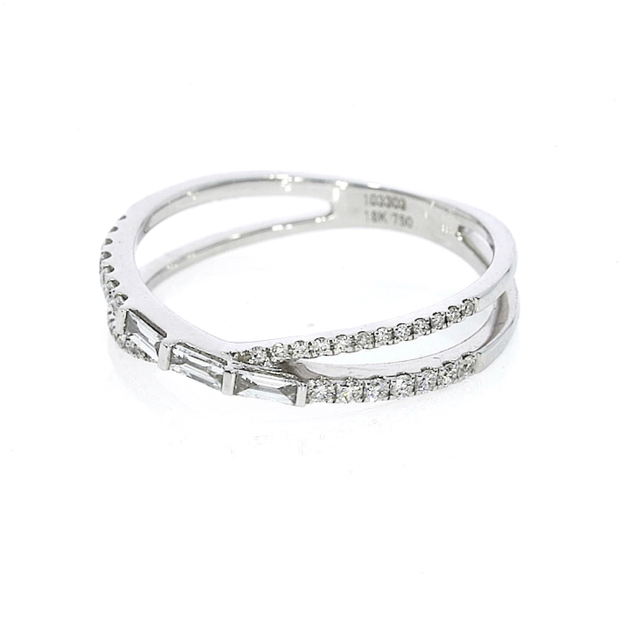White gold colour, modern criss-cross ring with 0.28cts of baguette and round cut  luxury fine diamonds in set in 18ct gold.  