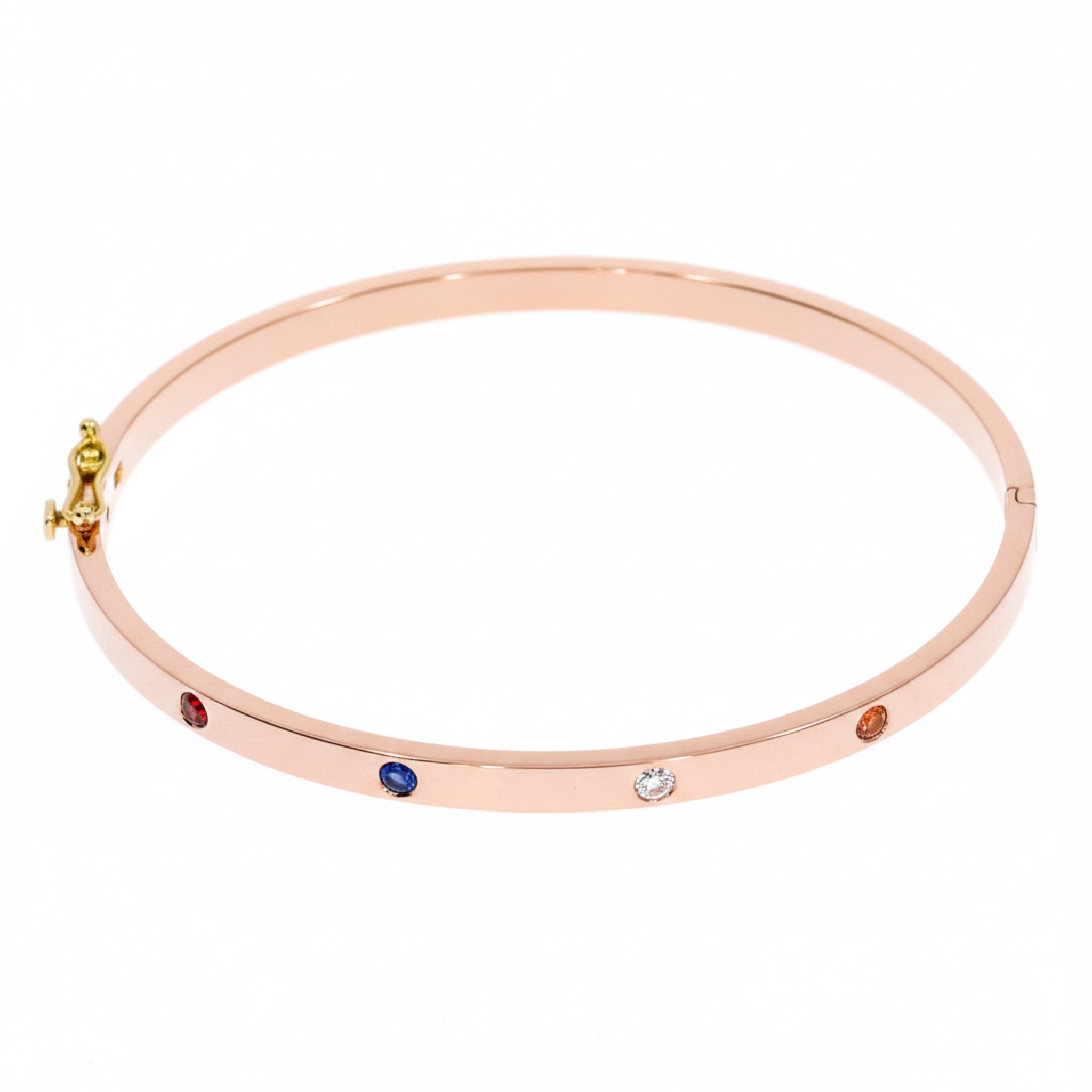 Elegant birthstone bangle in 18ct rose gold featuring four vibrant round brilliant cut birthstones.