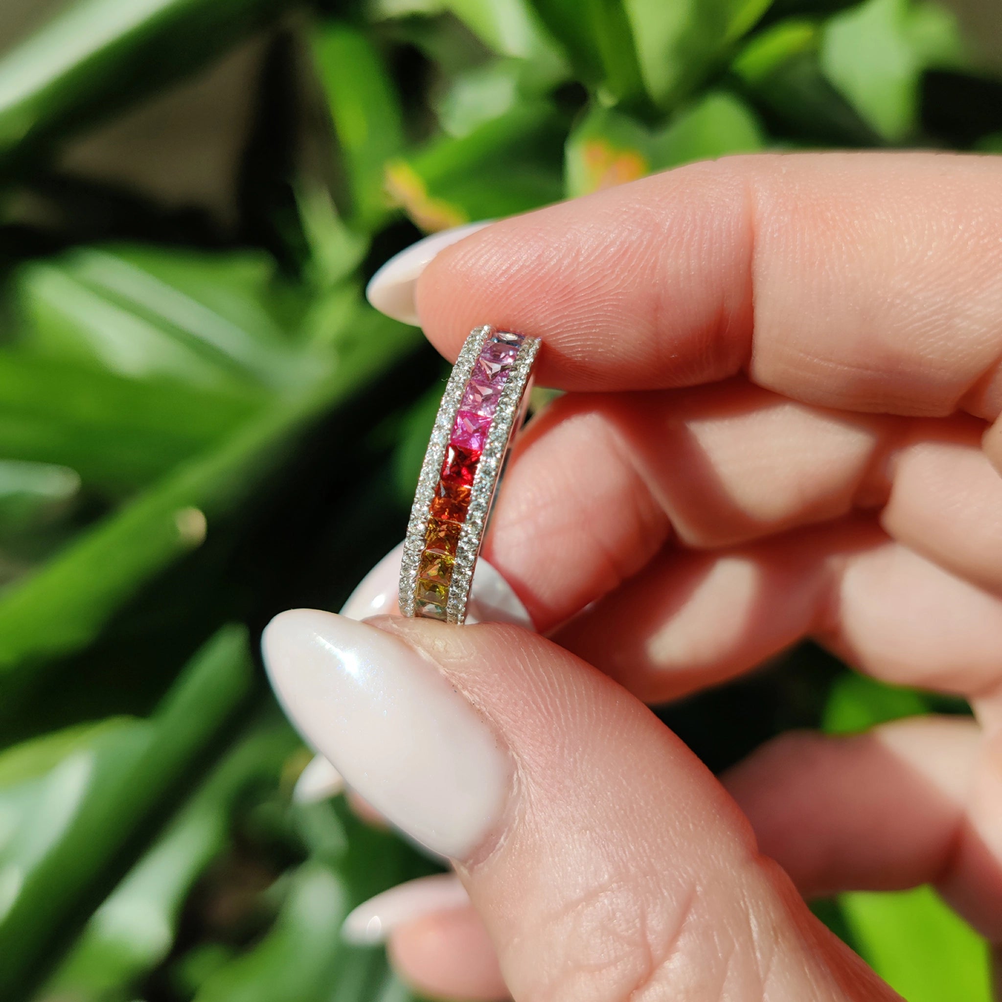 Elegant multi colour sapphire ring with diamonds, showcasing vibrant hues and exquisite craftsmanship.