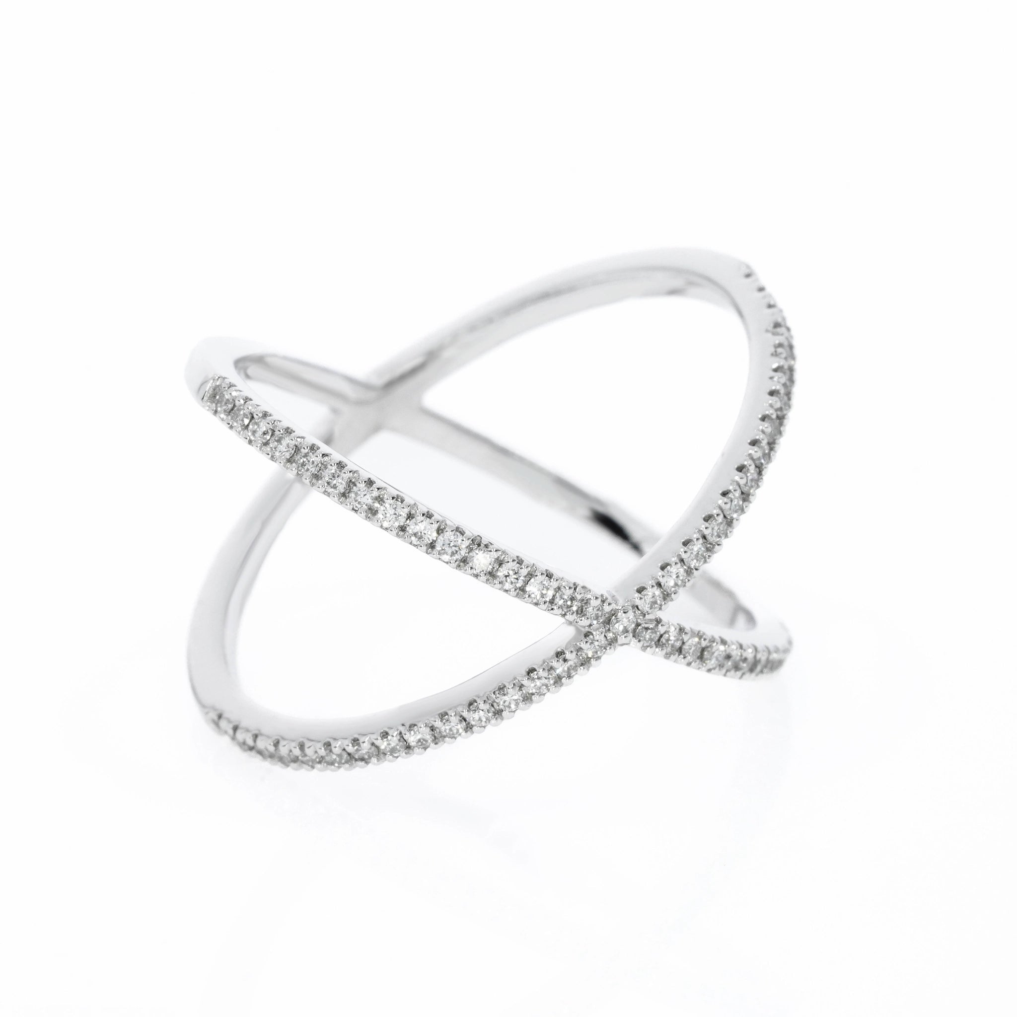 Criss cross ring with 0.23cts round brilliant cut diamonds, white gold colour set in 18ct gold. 