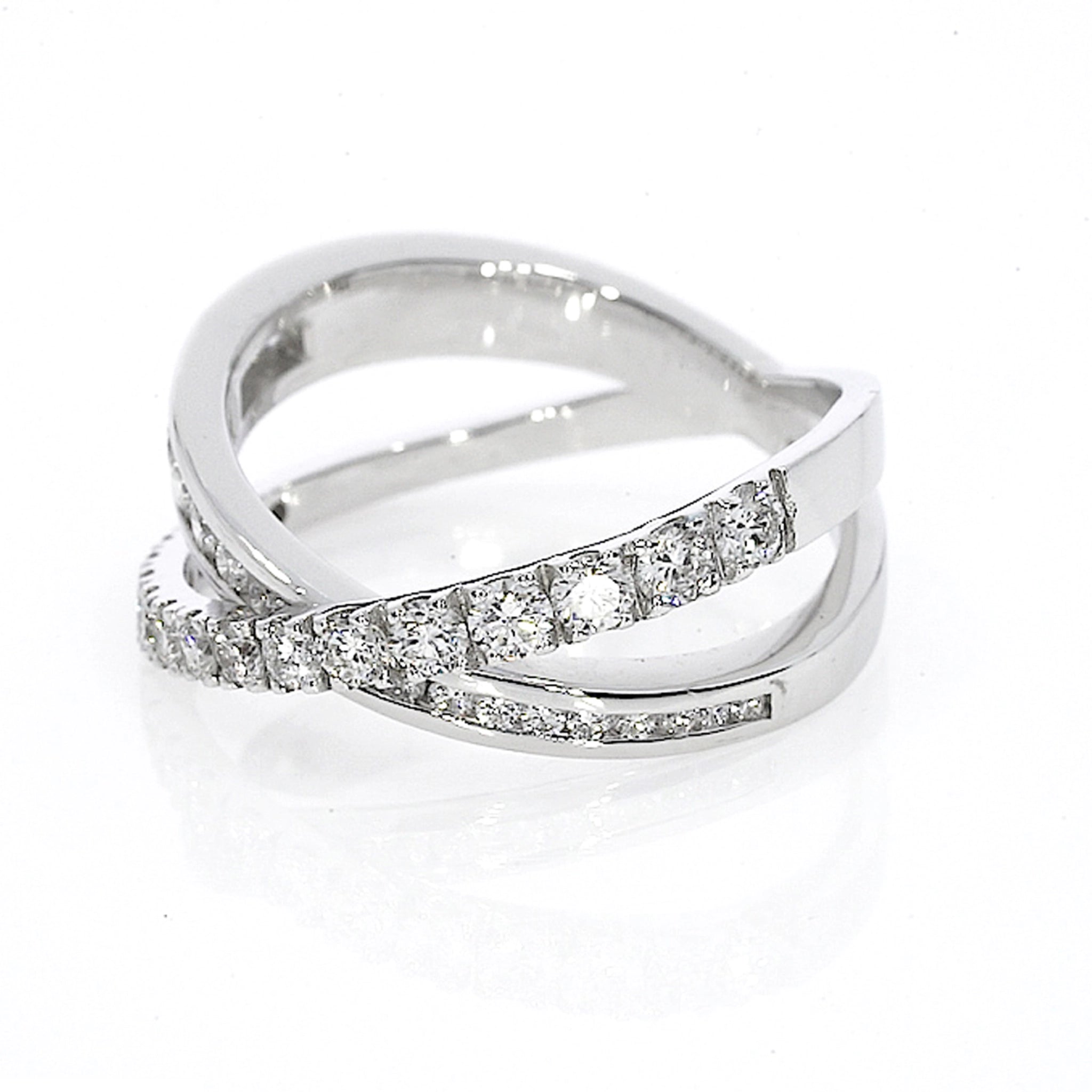 Criss-cross ring large with 0.84cts of claw-set luxury fine diamonds, intersecting bands for a sparkling look set in 18ct gold.