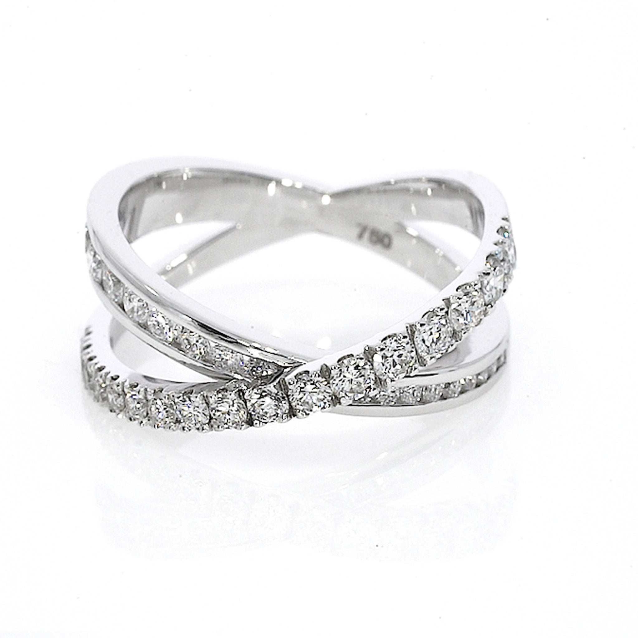 18ct gold criss-cross ring with 0.84cts of claw-set luxury fine diamonds, intersecting bands for a sparkling look.