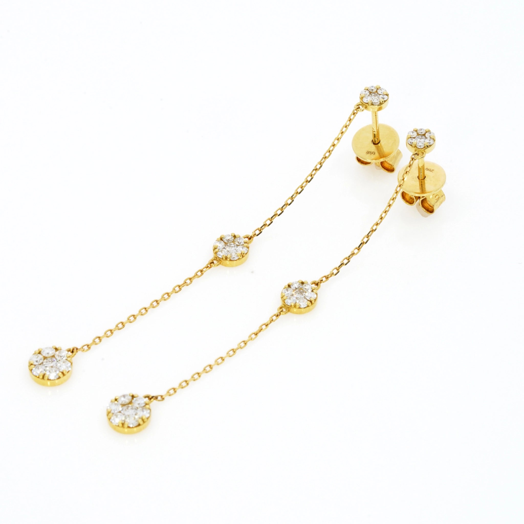 Elegant drop illusion earrings featuring certified diamond earrings in 18ct gold with diamond clusters.