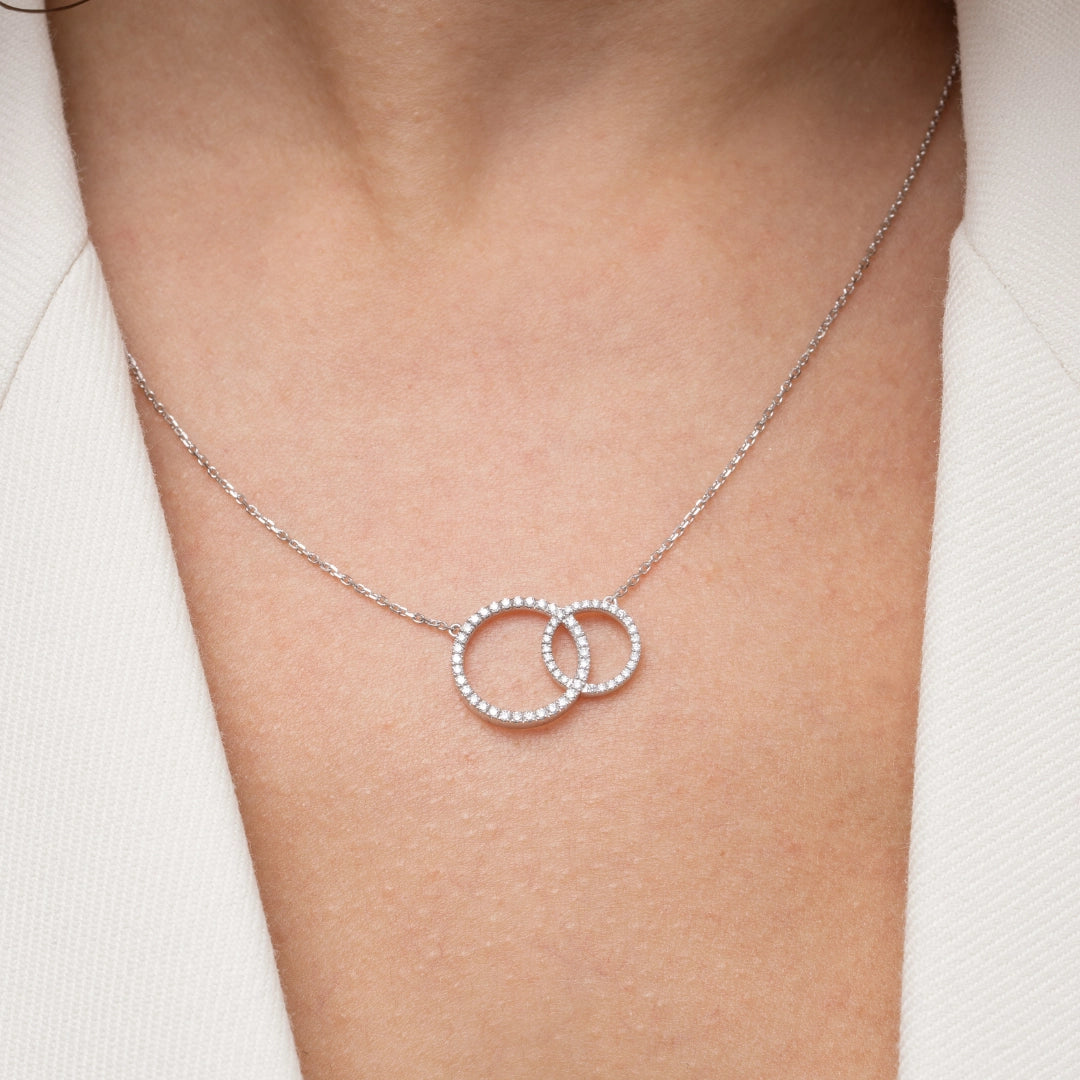 Duo Circle of Life Necklace featuring interlocking certified diamond circles set in 18ct gold with chain options.
