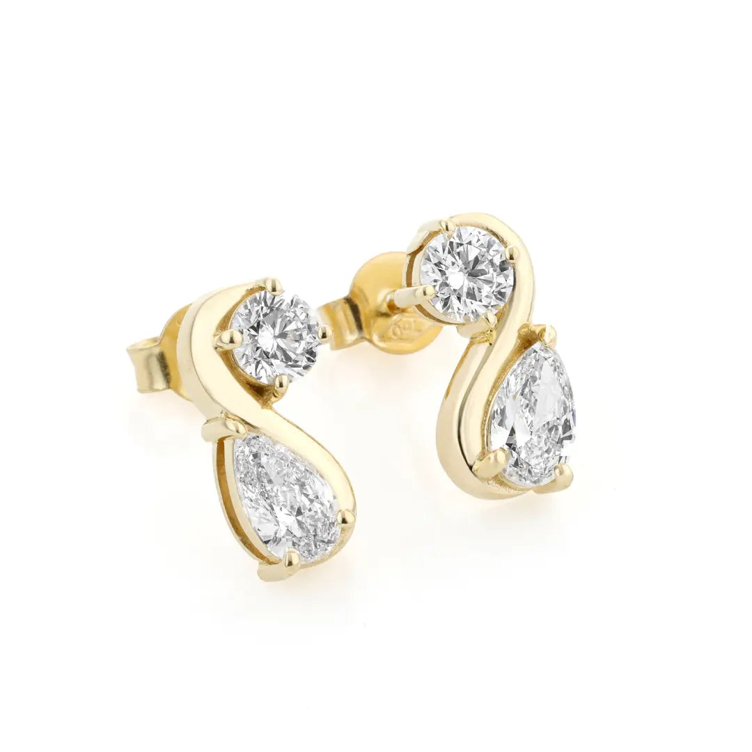 Yellow gold earrings with certified diamonds on a white background