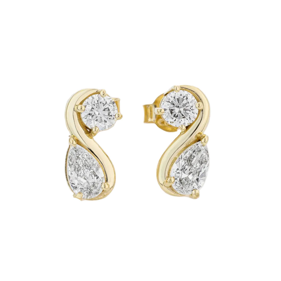 Yellow Gold earrings with pear shaped diamonds on a white background