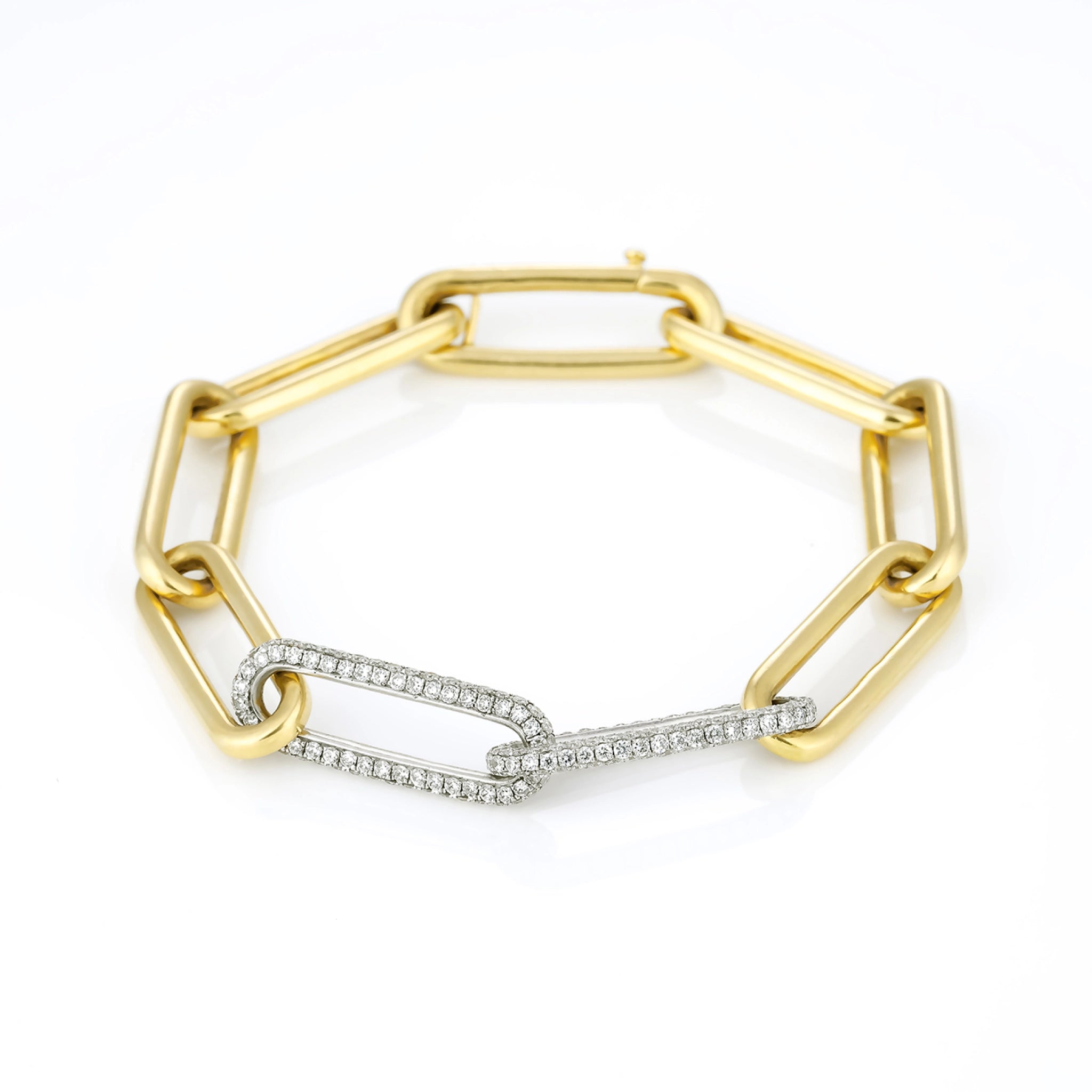 Elegant diamond bracelet featuring yellow and white gold links, adorned with brilliant cut diamonds.