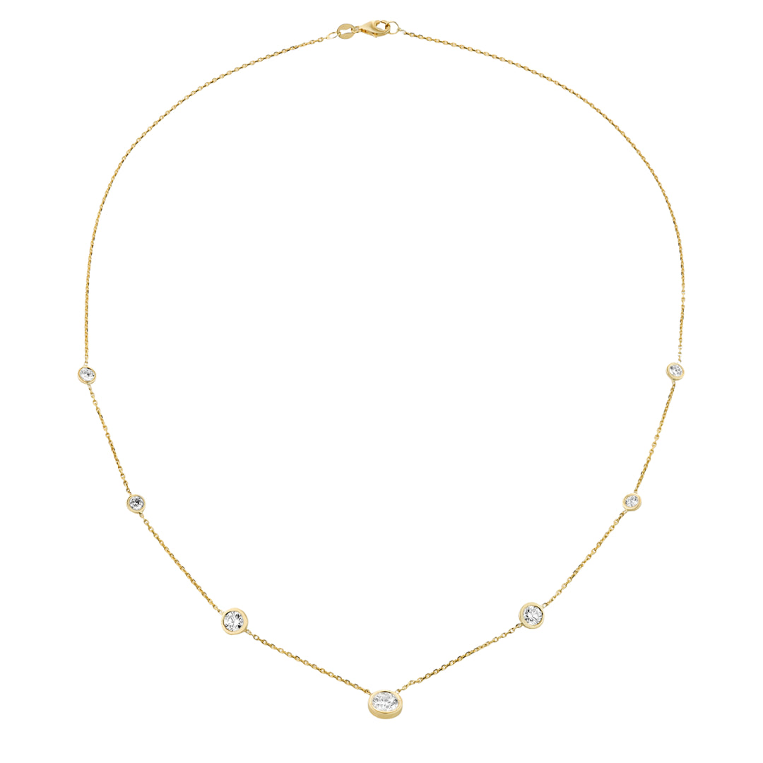 Constellation necklace featuring round brilliant cut diamonds in graduating bezel settings, crafted in 18ct yellow gold.