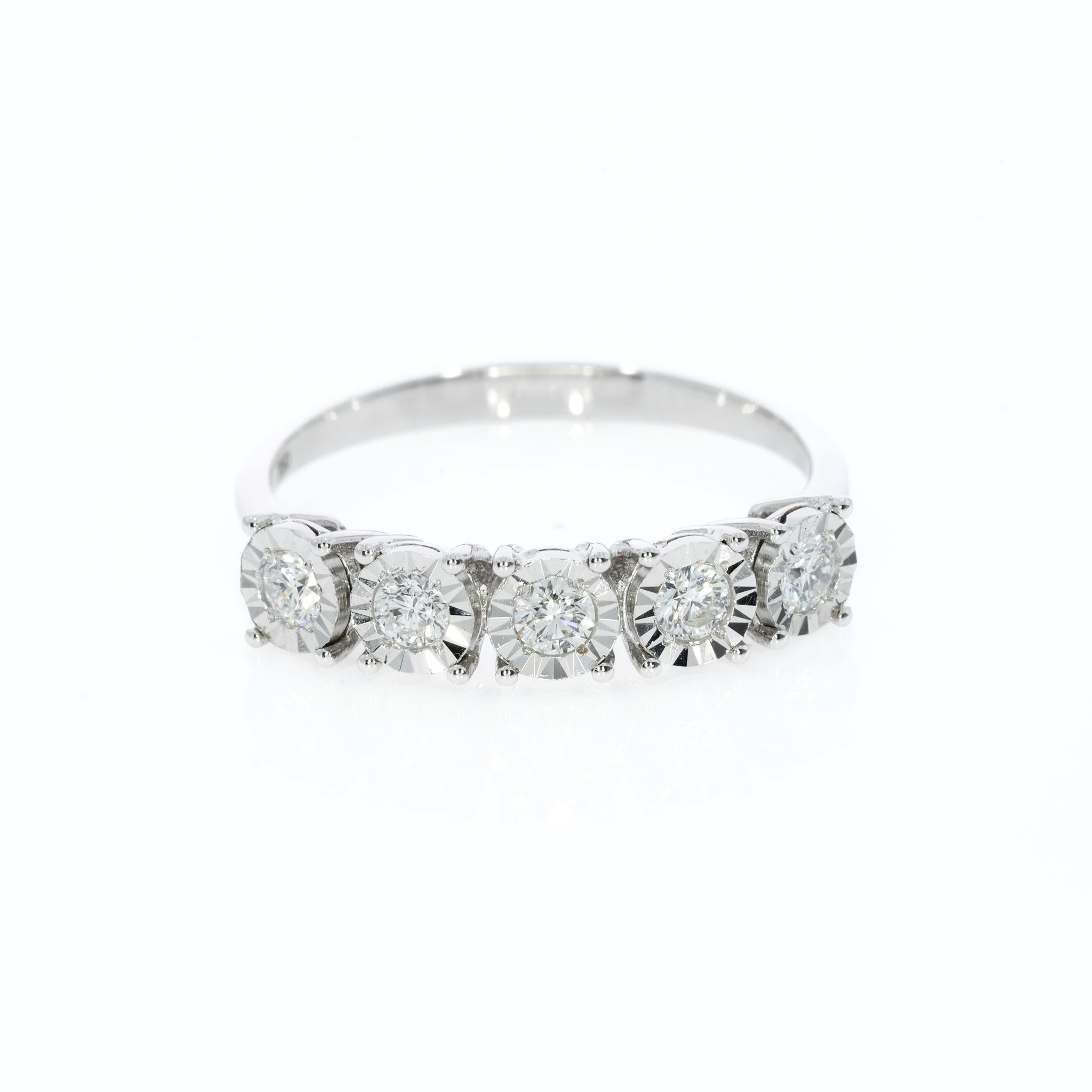 Five Stone Eternity Ring with Five round brilliant cut diamonds in a setting that makes each appear larger and adds extra sparkle.