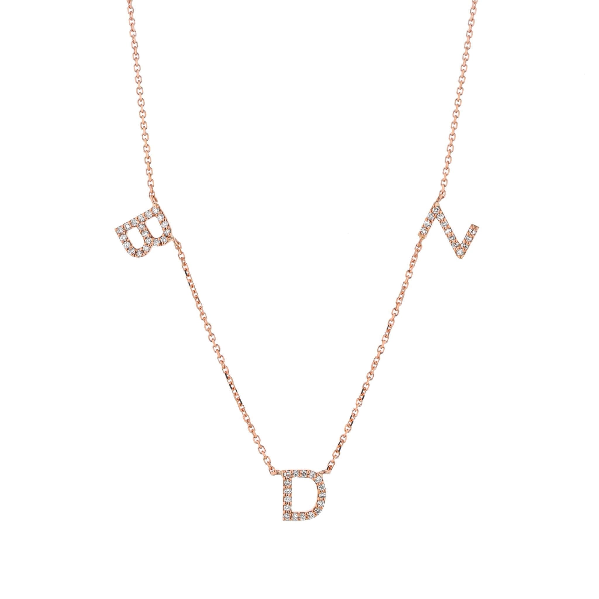 Love Letter necklace with diamond set initials on a fine link chain in 18ct gold.