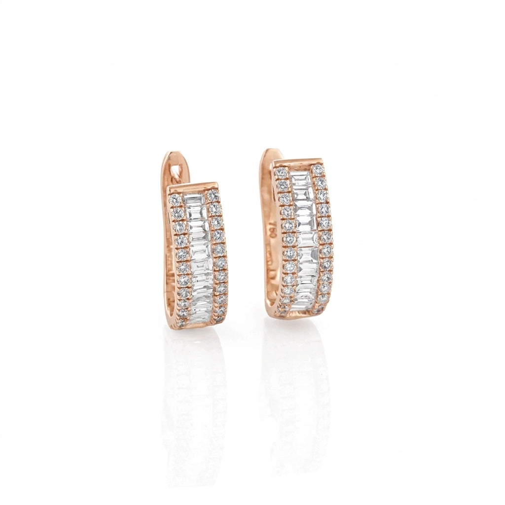 Rose gold hoop earrings with diamonds on a white background