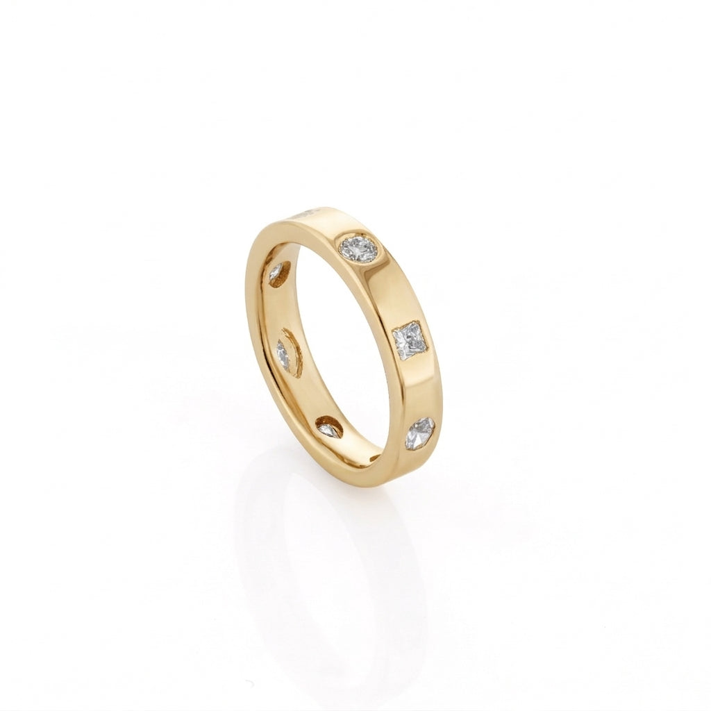 Yellow gold ring with embedded diamonds on a white background