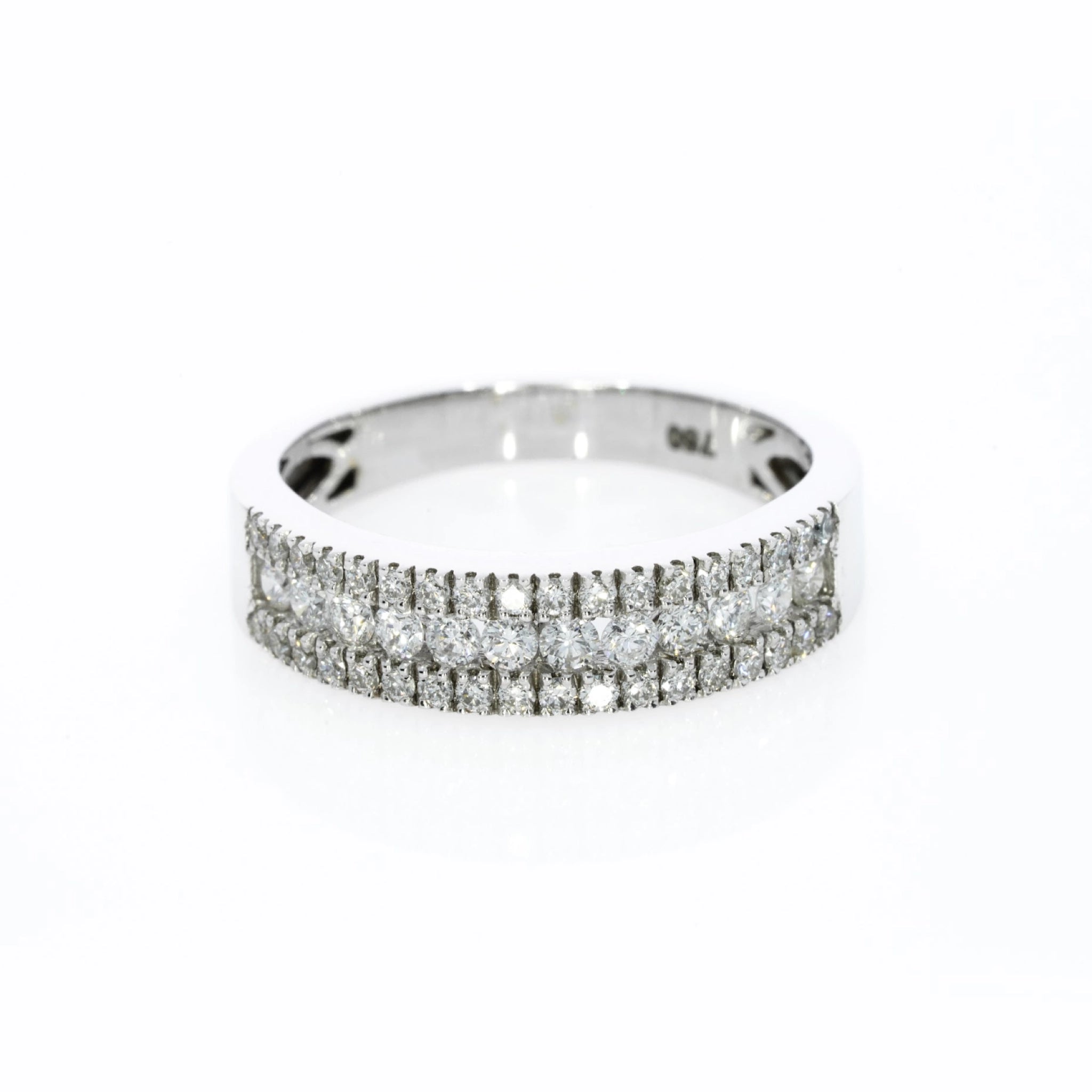 A delicate three-row pave diamond ring with 0.57cts diamonds, set in 18ct gold for optimal brilliance.