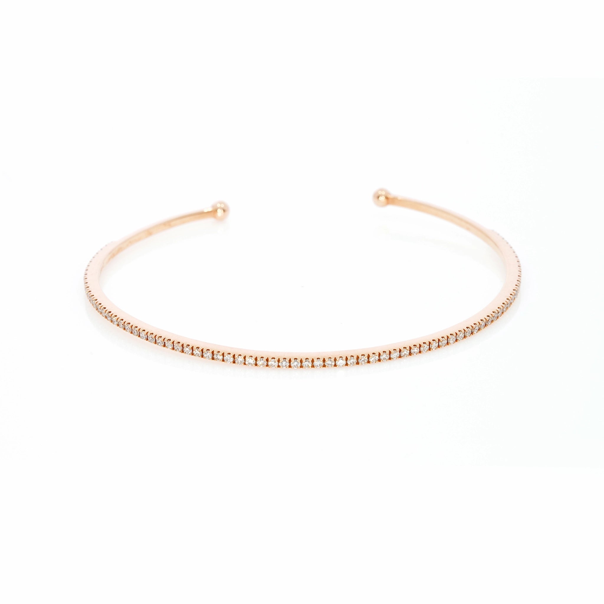 Elegant push on tennis bangle in 18ct gold featuring diamonds, total carat weight 0.73cts, modern and stylish design.